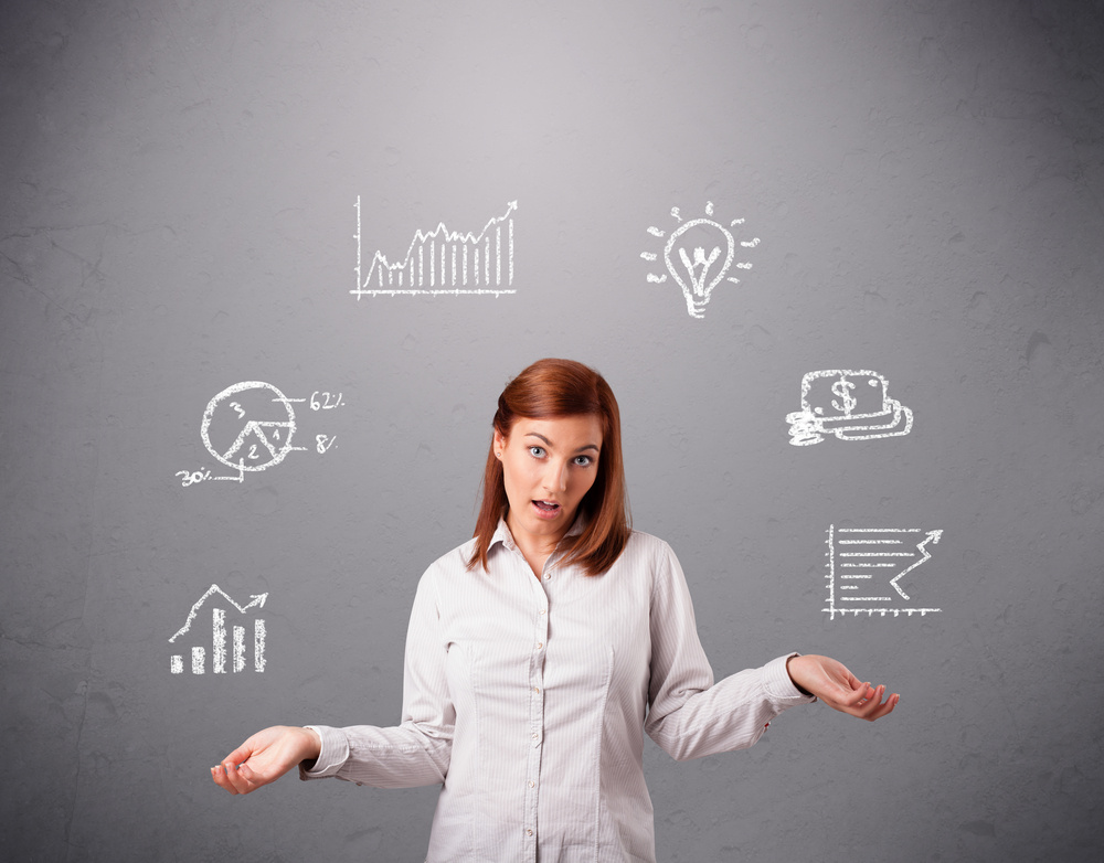 beautiful young woman standin and juggling with statistics and graphs